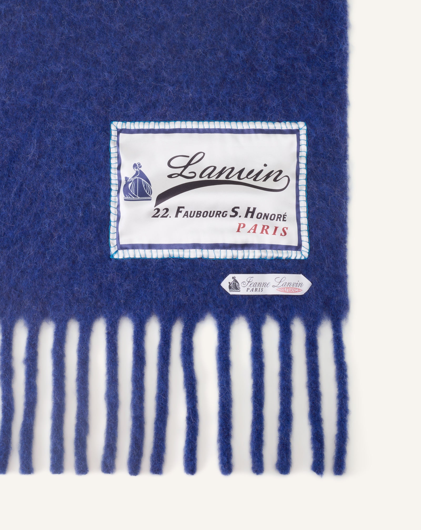 FRINGED WOOL SCARF WITH 22 FAUBOURG LABEL