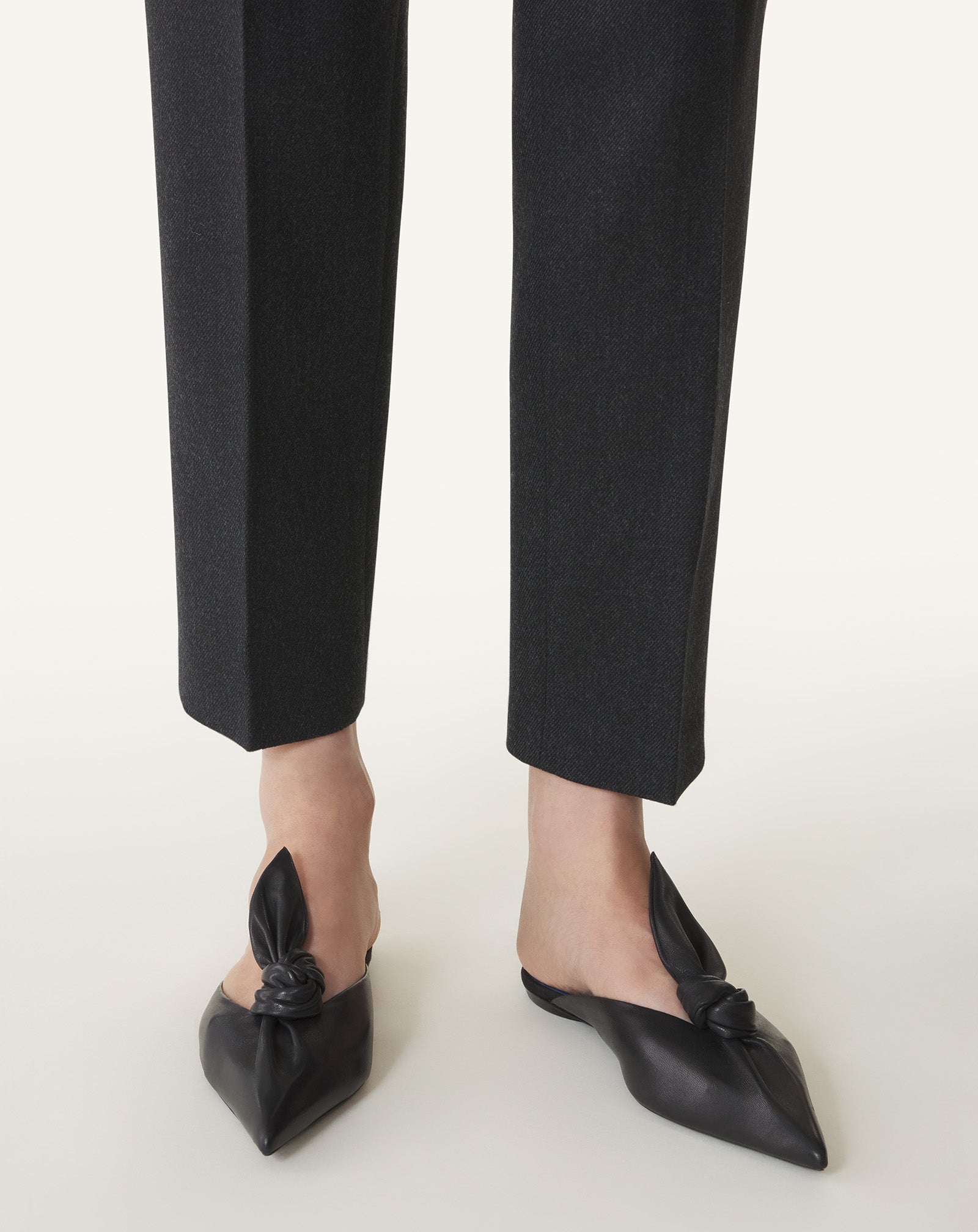 BLACK MIDNIGHT STEP MULES WITH A LEATHER BOW